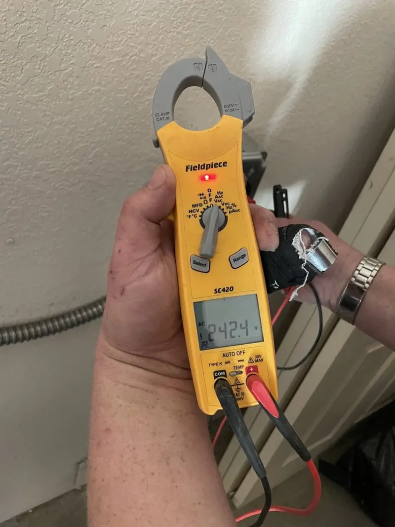 Voltage testing with clamp meter during Circuit Breaker Repair in Clayton